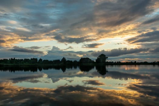 Reflection of clouds in the water of a calm lake, Stankow, Poland