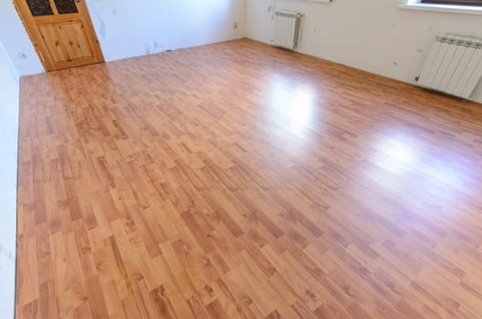 Laminate on the floor of the room after a major overhaul in the apartment