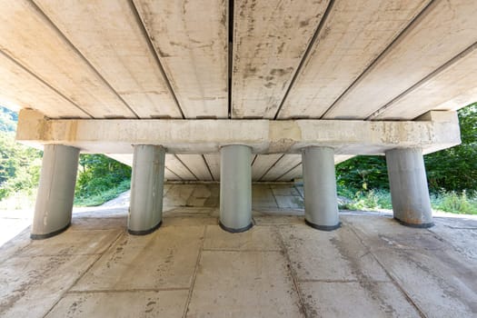 Close-up of bridge piers, concreted slope under the bridge