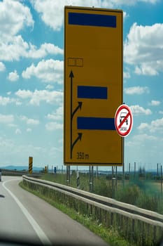Road signs on the German Autobahn showing the road to Magdeburg, Halle, Quidlingburg and Braunschweig