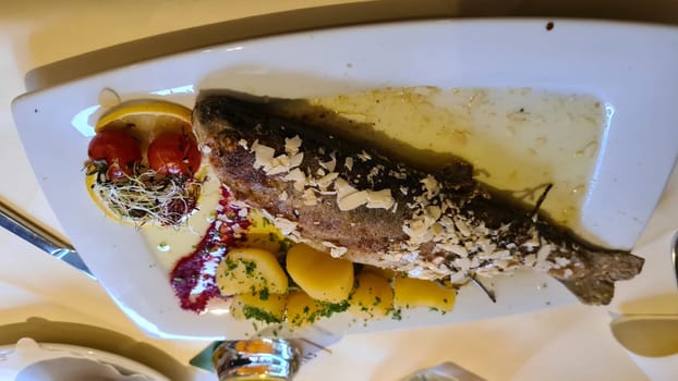 Grilled rainbow trout with red pepper, rosemary and potatoes