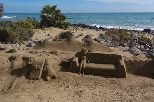 CRAN CANARIA, MELONERAS - 13. NOVEMBER 2019:.Sand sculptures on the beach of Meloneras, Spain with inscription Gran Canaria
