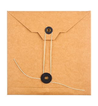 top view closeup of closed square vintage craft paper envelope with textile thread enclosing isolated on white background