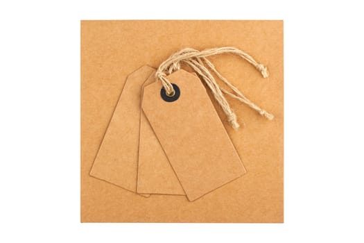 top view closeup gift set of craft paper tag and envelope with textile thread mockup isolated on white background