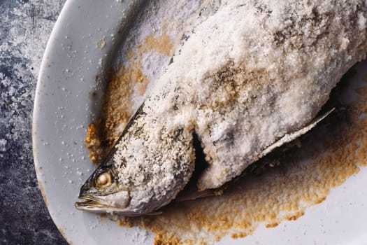 close up of sicilian italian salt baked seabass fish