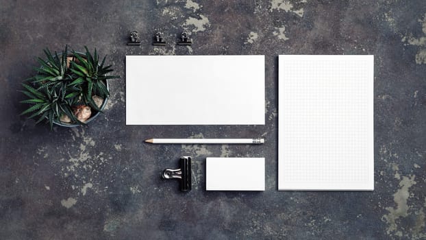 Blank corporate stationery set on concrete background. Template for branding design. Branding mock up. Top view.