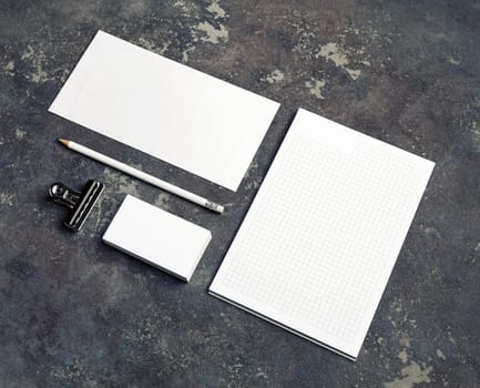 Blank branding identity set on concrete background. Corporate stationery template. For design presentations and portfolios.