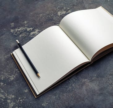 Mockup of opened blank brochure on concrete background.
