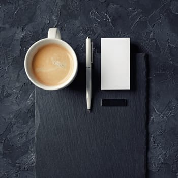 Blank business card, coffee cup, pen, usb flash drive. Top view.