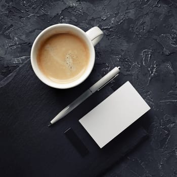 Blank business card, coffee cup, pen, usb flash drive. Template for placing your design. Top view.