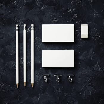 Photo of blank corporate identity. Stationery set. Branding mockup. business cards, pencils, eraser and clips. Top view. Flat lay.