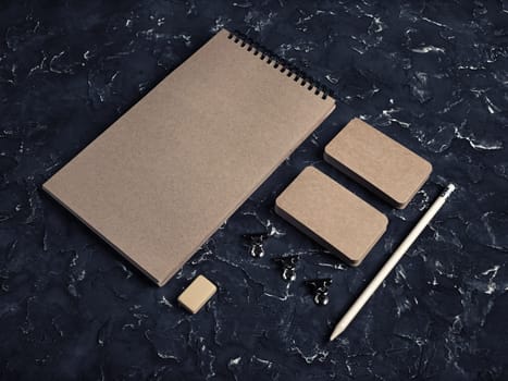Kraft stationery mock up. Blank corporate identity template on black plaster background. Responsive design mockup.