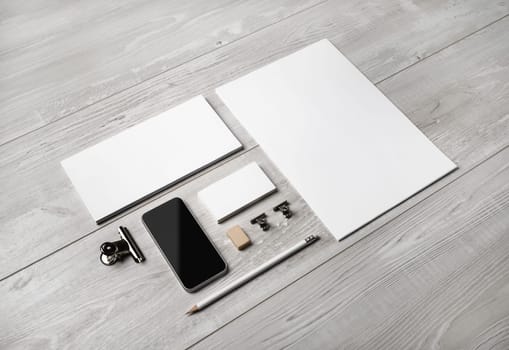 Blank corporate stationery set on light wooden background. Template for branding design. Branding mock up.