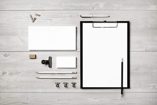 Blank stationery set on light wooden background. Template for branding identity. For graphic designers presentations and portfolios. Flat lay.