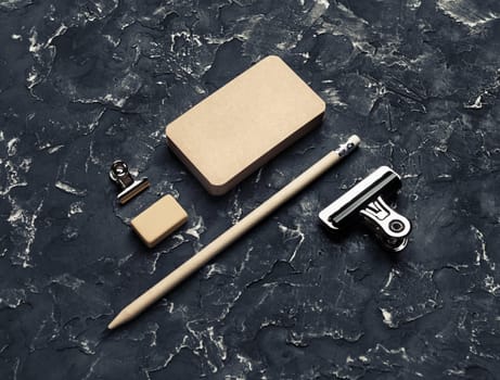 Blank vintage business cards, pencil, eraser and metal clips. Blank kraft stationery.