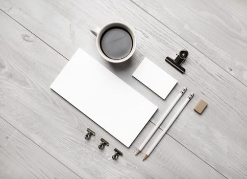 Blank business stationery set on light wooden background. Branding mock up. Flat lay.