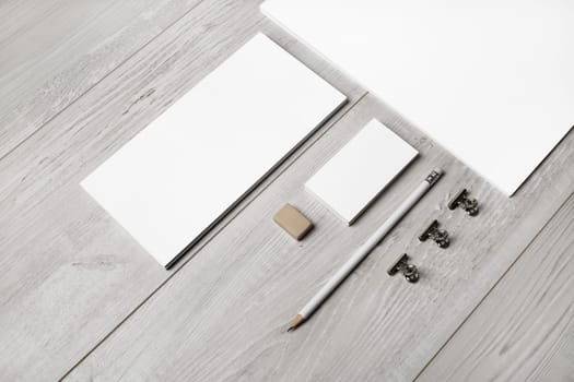 Blank stationery template on light wooden background. Mock-up for branding identity. For design presentations and portfolios.