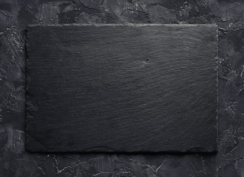 Blank black slate plate background. Top view.