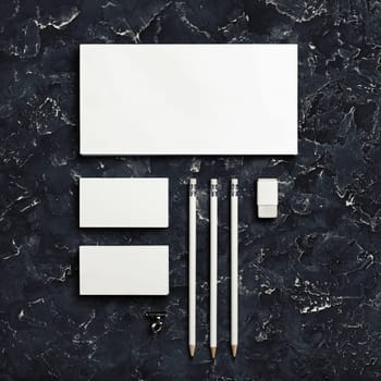 Branding stationery mockup on black plaster background. Blank objects for placing your design. Top view.
