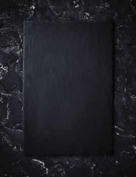 Blank black slate plate. Top view.