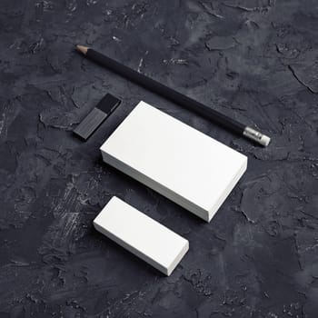 Photo of business cards, pencil, eraser and usb flash drive. Branding mock up.