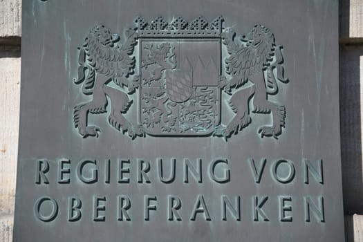 Bronze shield,Bronze shield from the government of Upper Franconia on a historic building in Bayreuth. The city of Bayreuth is located in Bavaria,Germany.