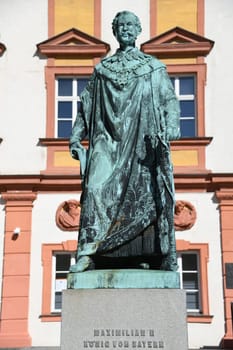 The monument to King Maximilian II of Bavaria stands in front of the Old Palace in Bayreuth on the courtyard. The statue of the Maximilian monument was cast in 1860. and stands on a granite base.