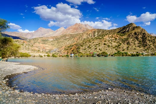 Scenic view of Iskanderkul - an alpine lake in the mountains of Tajikistan