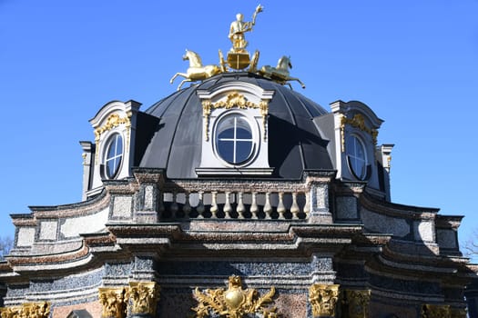 The Temple of the Sun in the Hermitage Bayreuth shows the gilded Apollo with torch,quadriga and horses. The temple was built in the park in 1753.