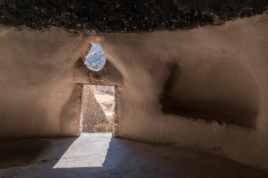 A view from inside of cavate - a natural cavity in the cliff expanded by the dwellers. Bandelier National Monument, New Mexico