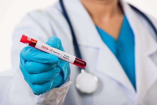 Doctor scientist in white uniform wear a mask holding test tube Coronavirus test blood sample in a clinical laboratory for analyzing isolated on white, medicine COVID-19 pandemic outbreak concept