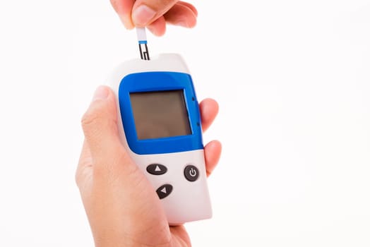 Closeup hands woman measuring glucose test level checking on a finger by glucometer she monitors and controls high blood sugar diabetes and glycemic health care concept isolated on white background