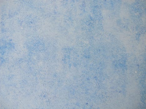 Wood painted with blue chalk paint and paint roller in vintage style