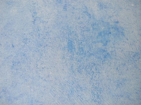 Wood painted with blue chalk paint and paint roller in vintage style
