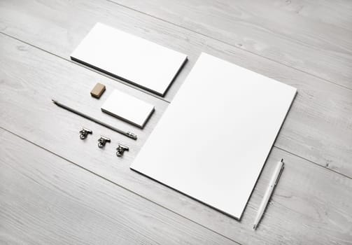 Blank corporate identity template on light wooden background. Photo of blank stationery set. Mockup for design presentations and portfolios.