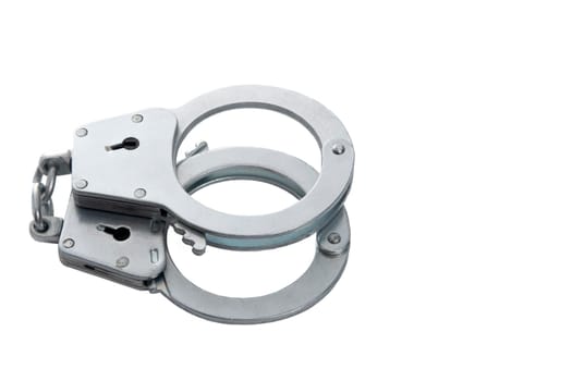 Metal handcuffs on a white isolated background, copy space. High quality photo