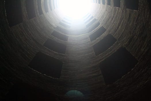 View of half of the San Patrizio Well (Pozzo di San Patrizio) with the sun coming in located in Orvieto in Umbria in Italy