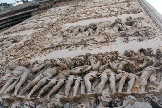 A tale told by the marble wall of the Orvieto Cathedral (Duomo di Orvieto) in Umbria in Italy
