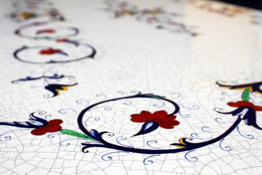 Close up of a white table made with porcelain in Deruta in Umbria in Italy