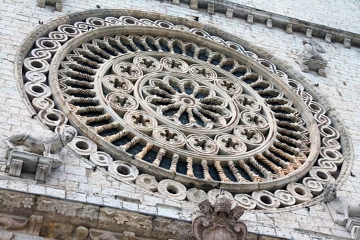 The masterpiece rosette of the Assisi Abbey in Umbria in the center of Italy