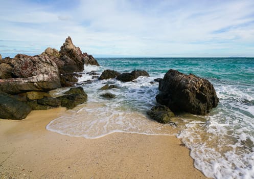 Sand beach among rocks, koh lan island thailand