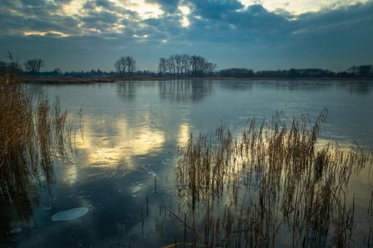 Reflection of the sky on a frozen lake, Stankow, Poland