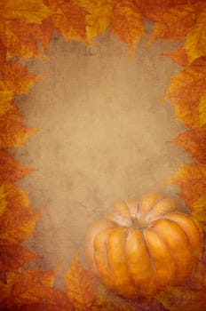 Pumpkin and maple leaves design on textured background