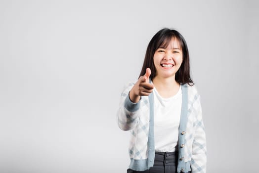 Woman winning and surprised excited screaming laughing pointing finger to camera studio shot isolated white background, Happy Asian portrait beautiful young female lifestyle cheerful laugh funny