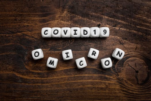 Corona virus Covid-19 vaccine text on wooden background