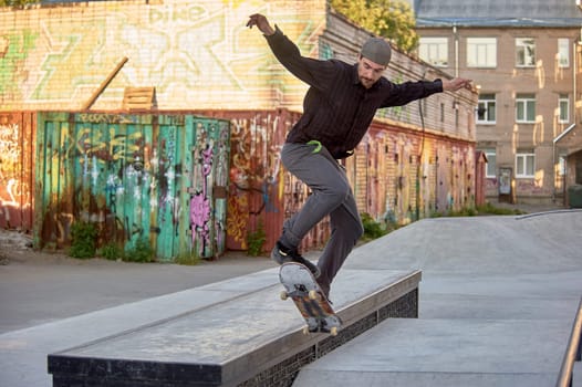 a skateboarder rides a skateboard in a skatepark, does tricks. High quality photo
