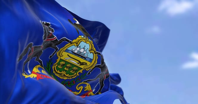 The US state flag of Pennsylvania waving in the wind. Pennsylvania is a U.S. state spanning the Mid-Atlantic, Northeastern, and Appalachian regions of the United States. Democracy and independence.