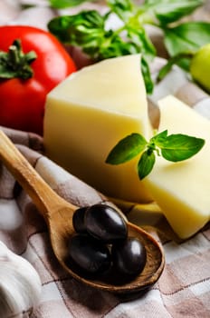 Cheese slices and black olives