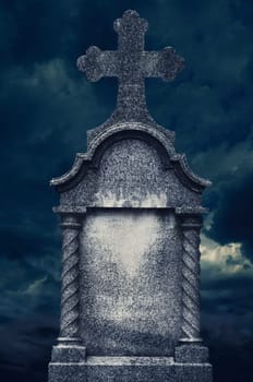 Old tombstone at night. halloween concept.