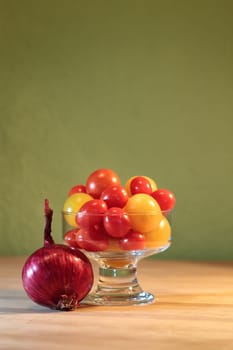 Still life with onion and tomato in jar